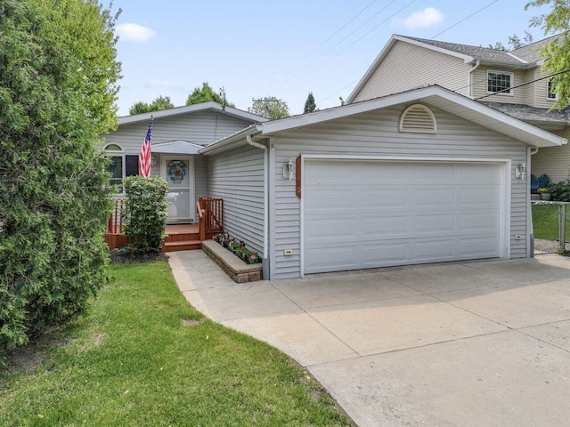 12129 221st Ave, Bristol, WI 53104 - view of front of home with concrete driveway, a garage, and a front yard