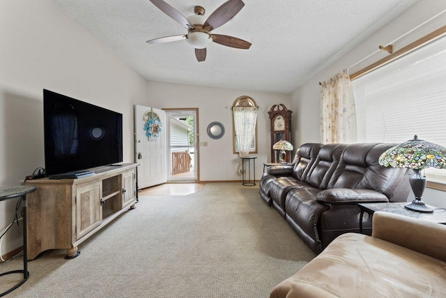 12129 221st Ave, Bristol, WI 53104 - living area with ceiling fan, light carpet, vaulted ceiling, and a textured ceiling