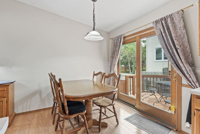 12129 221st Ave, Bristol, WI 53104 - dining space with light wood-style floors and a textured ceiling