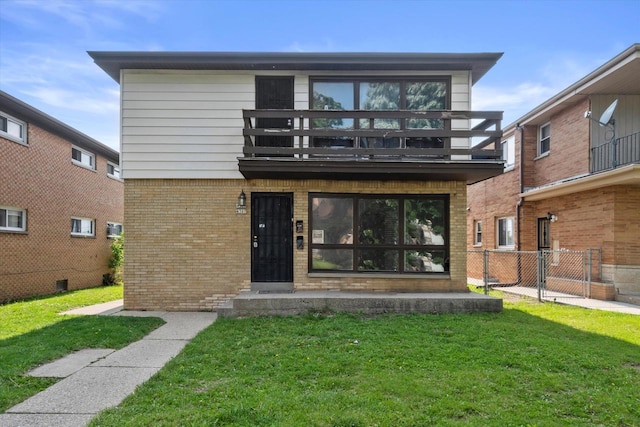 4307 N 91st St Unit 4309, Milwaukee, WI 53222 - rear view of property featuring a balcony and brick siding
