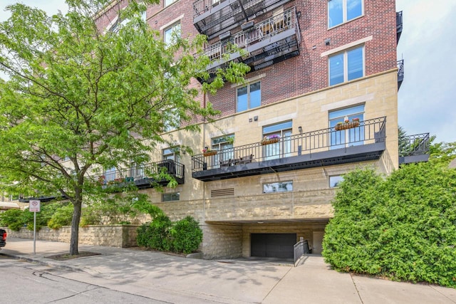 1515 N Van Buren St Unit 414, Milwaukee, WI 53202 - view of building exterior with a garage