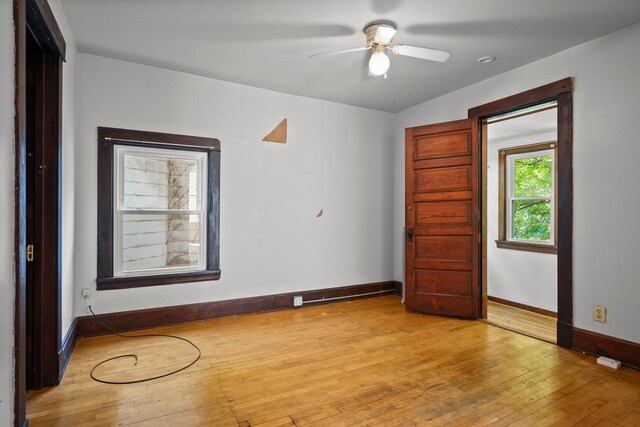 1049 E Johnson St, Madison, WI 53703 - empty room with light wood-style floors and a ceiling fan