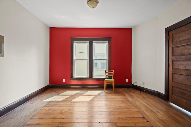 1049 E Johnson St, Madison, WI 53703 - spare room featuring hardwood / wood-style floors