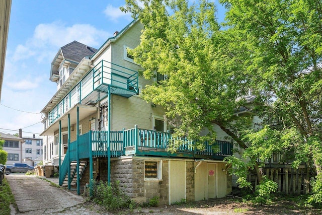 1049 E Johnson St, Madison, WI 53703 - view of home's exterior with stairs and a wooden deck