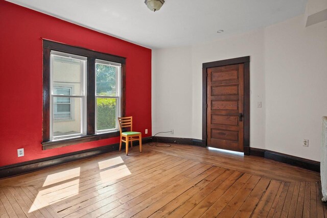 1049 E Johnson St, Madison, WI 53703 - spare room featuring wood-type flooring