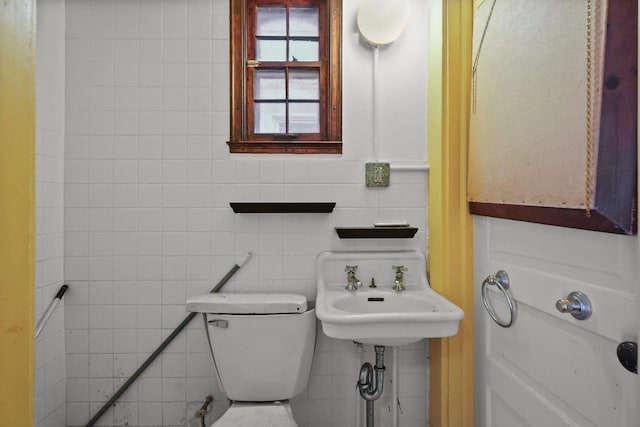 1049 E Johnson St, Madison, WI 53703 - bathroom featuring toilet and tile walls