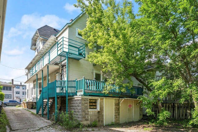 1049 E Johnson St, Madison, WI 53703 - view of home's exterior with stairs and a wooden deck