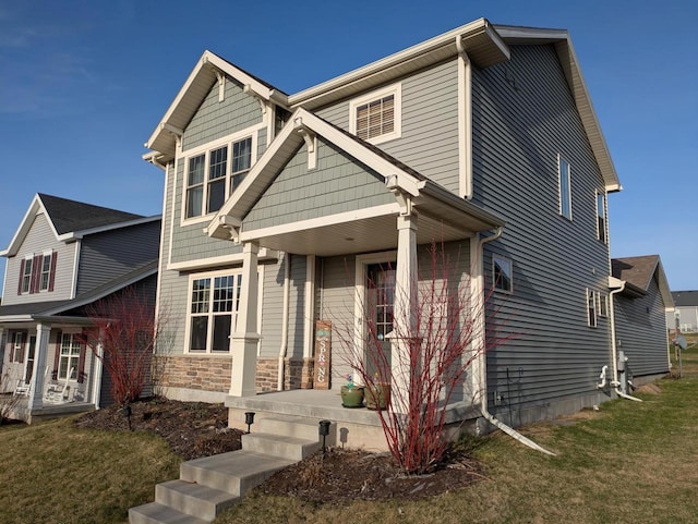 207 Sugar Maple Ln, Verona, WI 53593 - craftsman house with covered porch and a front yard