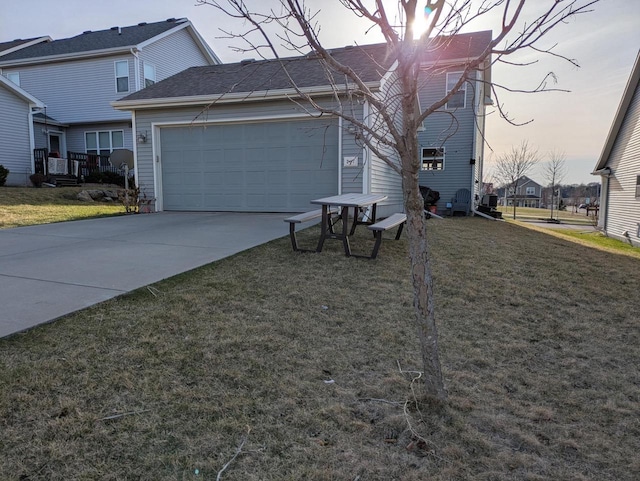 207 Sugar Maple Ln, Verona, WI 53593 - view of side of home featuring concrete driveway, a garage, and a yard