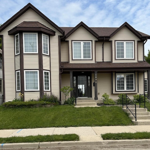 1304 W Garfield Ave, Milwaukee, WI 53205 - view of front facade featuring a front lawn and a shingled roof