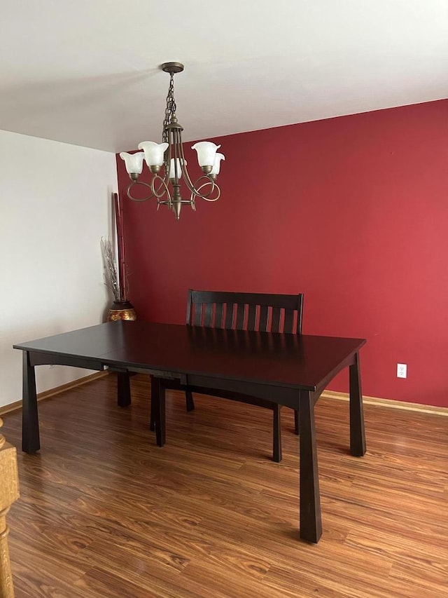 1304 W Garfield Ave, Milwaukee, WI 53205 - dining space with a chandelier and wood finished floors