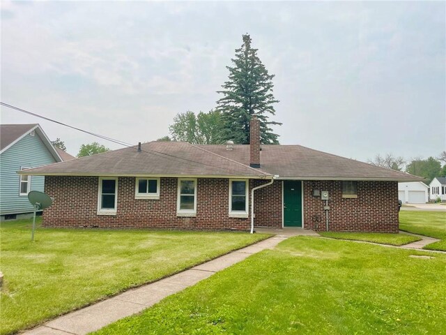 628 W Cedar St, Chippewa Falls, WI 54729 - single story home with a chimney, a front yard, and brick siding