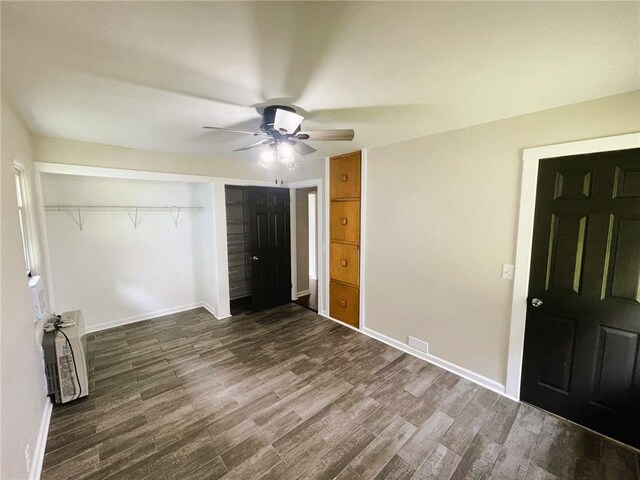 628 W Cedar St, Chippewa Falls, WI 54729 - unfurnished bedroom featuring wood finished floors, a closet, and ceiling fan