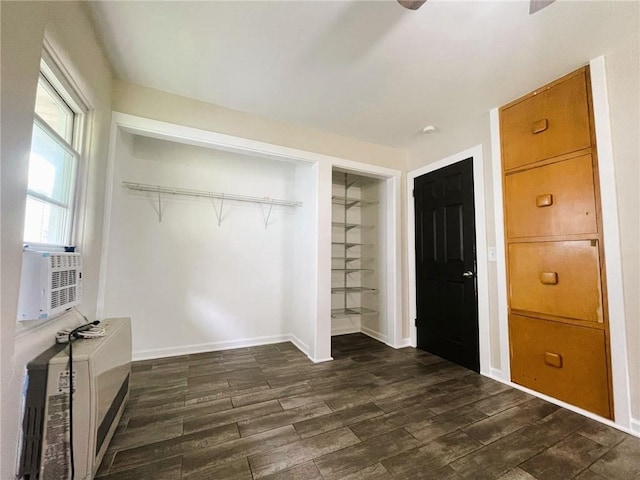 628 W Cedar St, Chippewa Falls, WI 54729 - unfurnished bedroom featuring dark wood-style flooring, a closet, cooling unit, and heating unit