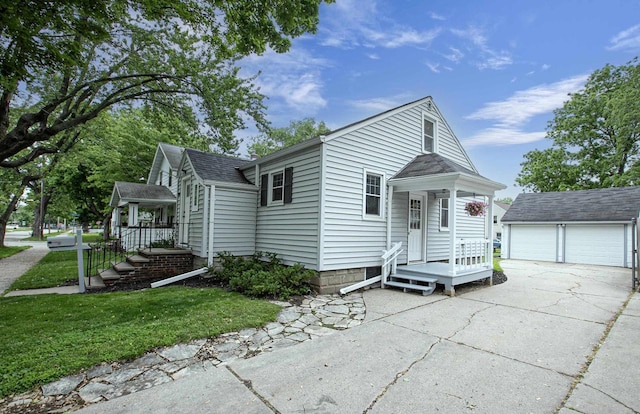 318 N Outagamie St, Appleton, WI 54914 - view of front of property with an outbuilding, a garage, and a front yard