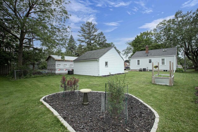 318 N Outagamie St, Appleton, WI 54914 - view of yard featuring a garden and an outbuilding