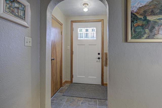 318 N Outagamie St, Appleton, WI 54914 - entryway with arched walkways, a textured wall, and tile patterned floors