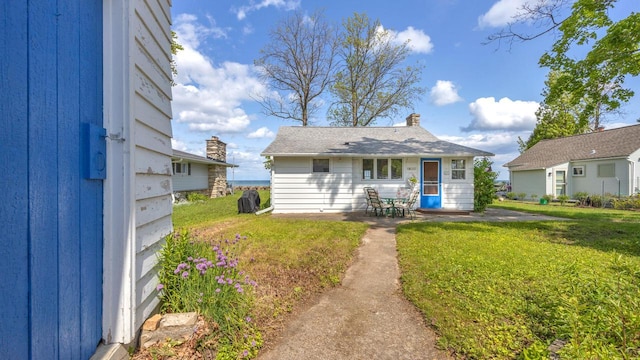 N133 Surfside Dr, Cedar Grove, WI 53013 - back of property with a patio area and a lawn