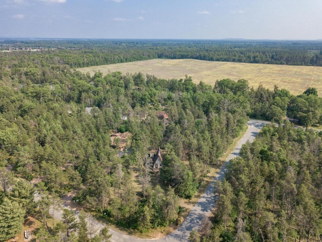 N8244 Woodland Trl, New Lisbon, WI 53950 - aerial view of property and surrounding area featuring a heavily wooded area