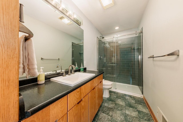 W301S1487 Brandybrook Rd, Waukesha, WI 53188 - bathroom featuring vanity, a stall shower, stone finish floors, and recessed lighting