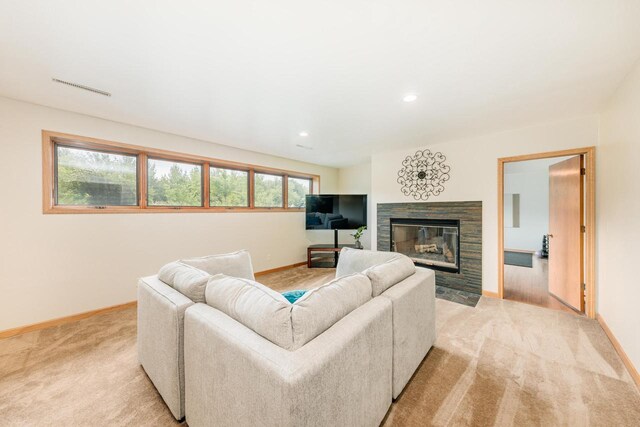 W301S1487 Brandybrook Rd, Waukesha, WI 53188 - living room with light colored carpet, a stone fireplace, and recessed lighting