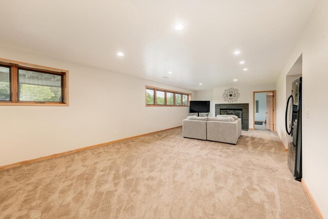 W301S1487 Brandybrook Rd, Waukesha, WI 53188 - unfurnished living room with light carpet, recessed lighting, and a glass covered fireplace