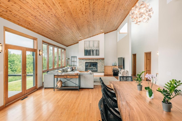 W301S1487 Brandybrook Rd, Waukesha, WI 53188 - living area with french doors, a glass covered fireplace, light wood finished floors, wooden ceiling, and high vaulted ceiling