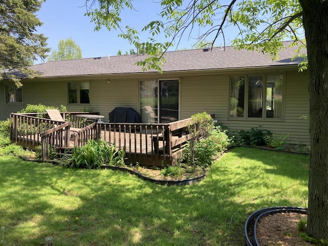 3988 S 18th St, Sheboygan, WI 53081 - rear view of house featuring a deck, a yard, and a shingled roof