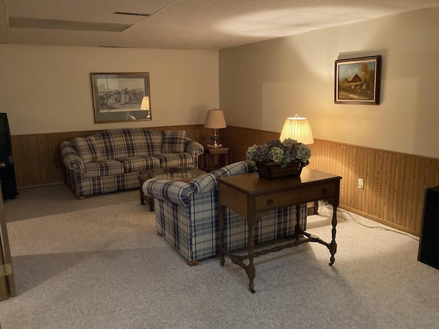 3988 S 18th St, Sheboygan, WI 53081 - living room with wainscoting, carpet floors, and wooden walls