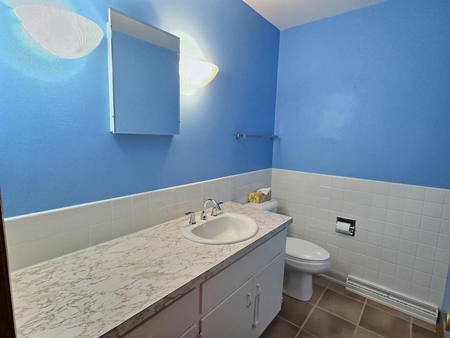 525 Pembrook Ct, Neenah, WI 54956 - bathroom with a baseboard radiator, vanity, and tile patterned flooring