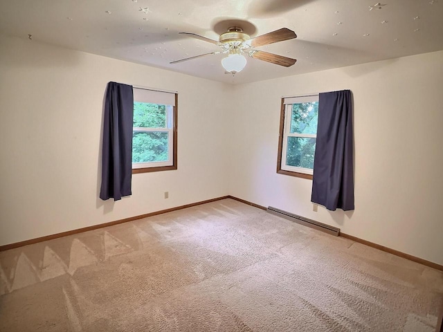 525 Pembrook Ct, Neenah, WI 54956 - empty room with a baseboard heating unit, light carpet, and a ceiling fan