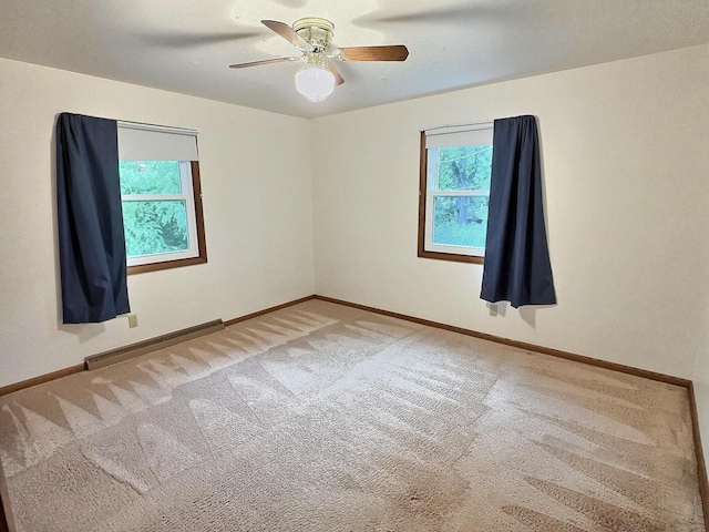 525 Pembrook Ct, Neenah, WI 54956 - spare room with a baseboard radiator, plenty of natural light, carpet, and a ceiling fan