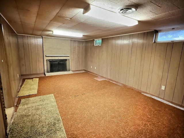 525 Pembrook Ct, Neenah, WI 54956 - below grade area with a fireplace, carpet flooring, and wooden walls