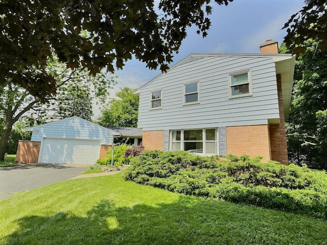 525 Pembrook Ct, Neenah, WI 54956 - view of front of property with a chimney, a front lawn, and brick siding