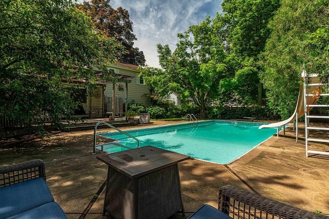 1329 23rd Ave, Monroe, WI 53566 - outdoor pool with a water slide and a patio