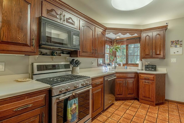 1329 23rd Ave, Monroe, WI 53566 - kitchen with stainless steel appliances, light countertops, and brown cabinetry