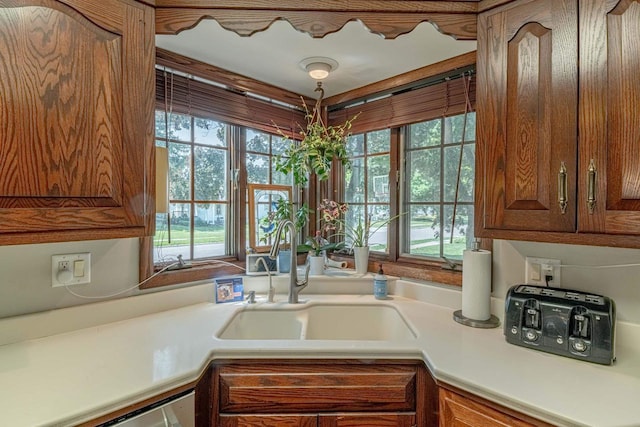 1329 23rd Ave, Monroe, WI 53566 - kitchen featuring light countertops and brown cabinets