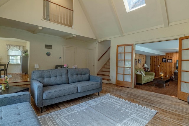 1329 23rd Ave, Monroe, WI 53566 - living room with high vaulted ceiling, stairway, wood finished floors, and beamed ceiling