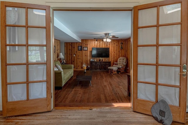 1329 23rd Ave, Monroe, WI 53566 - living area featuring wood finished floors, ceiling fan, and wood walls