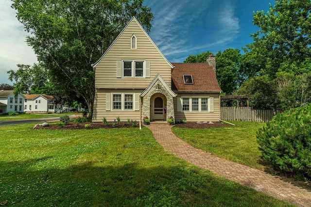 1329 23rd Ave, Monroe, WI 53566 - tudor home with a chimney and stone siding