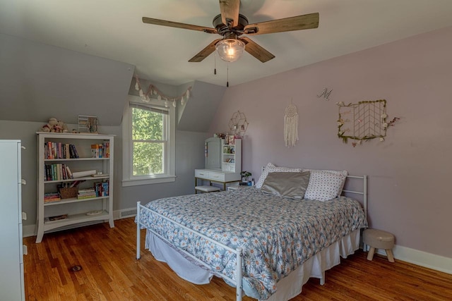 1329 23rd Ave, Monroe, WI 53566 - bedroom with wood finished floors, vaulted ceiling, and a ceiling fan