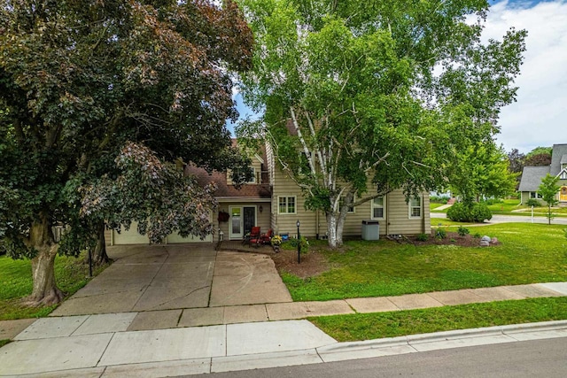 1329 23rd Ave, Monroe, WI 53566 - view of property hidden behind natural elements featuring a front yard and driveway
