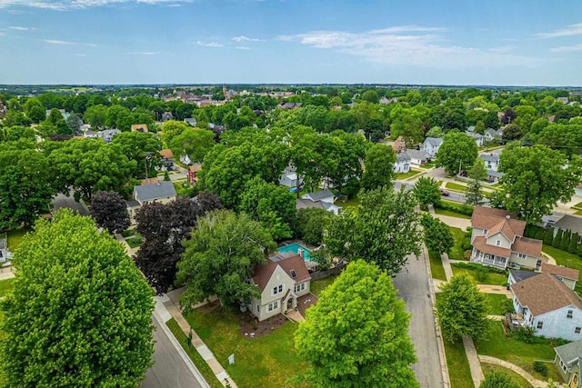 1329 23rd Ave, Monroe, WI 53566 - aerial view of residential area with a tree filled landscape
