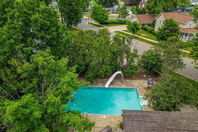 1329 23rd Ave, Monroe, WI 53566 - view of pool with a water slide and view of wooded area