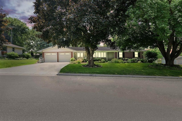 435 S Main St, Markesan, WI 53946 - single story home with an attached garage, concrete driveway, and a lawn
