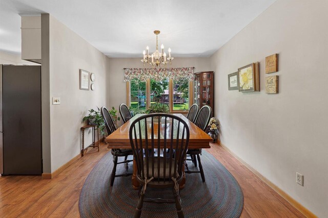 435 S Main St, Markesan, WI 53946 - dining room with a chandelier and wood finished floors