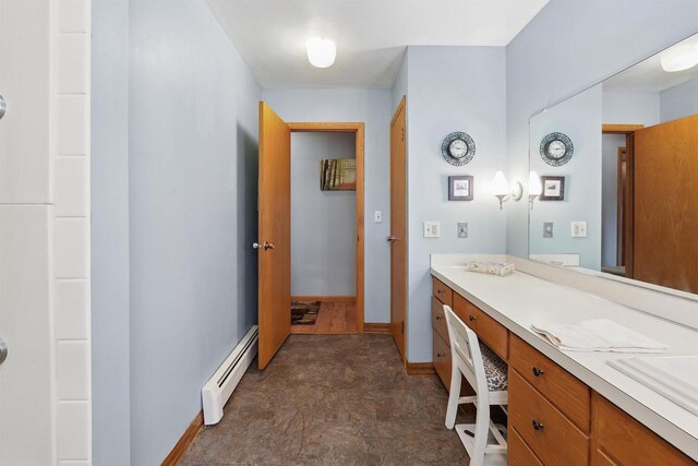 435 S Main St, Markesan, WI 53946 - bathroom with a baseboard radiator and vanity