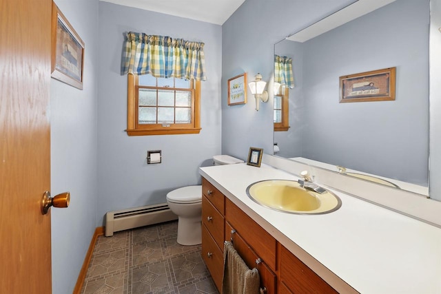 435 S Main St, Markesan, WI 53946 - half bathroom featuring a baseboard radiator and vanity