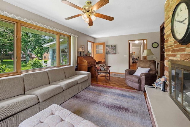 435 S Main St, Markesan, WI 53946 - living room featuring a ceiling fan and a fireplace