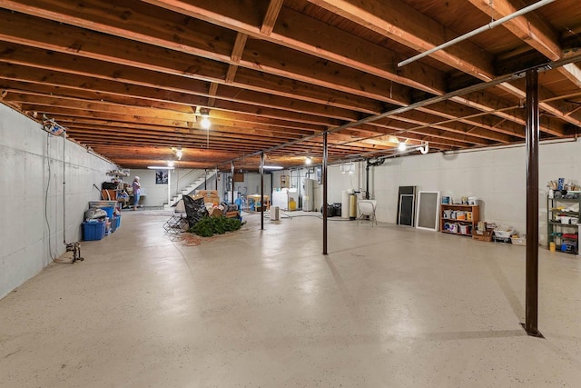 435 S Main St, Markesan, WI 53946 - unfinished basement featuring stairway and water heater